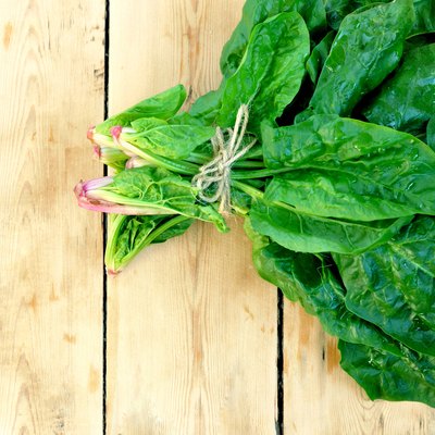Spinach on the wooden table