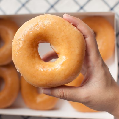 Hand picking donuts