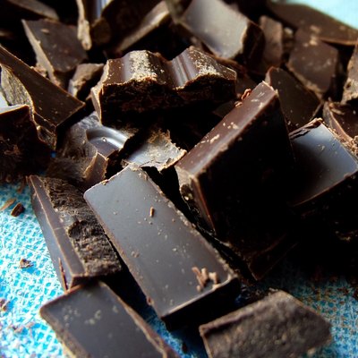 Chopped Dark Chocolate on Blue Cutting Board