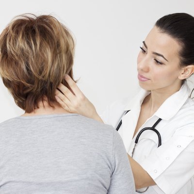 Young female doctor examining her patient