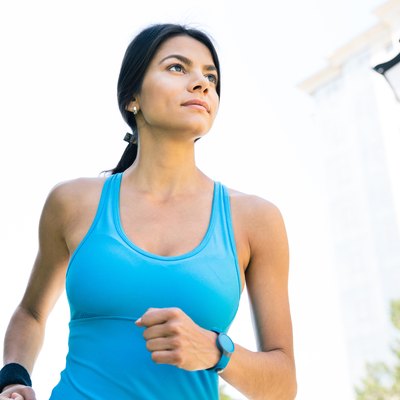 Sports woman running outdoors