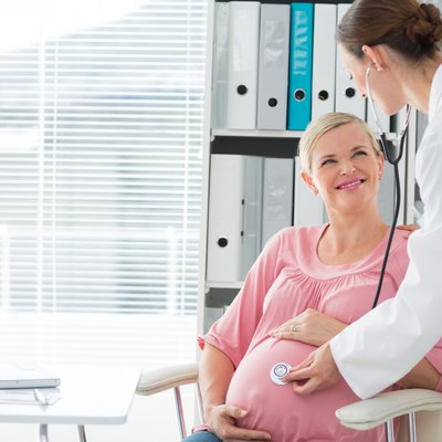 Doctor examining pregnant woman