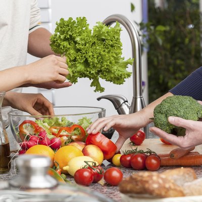 Friends making a salad