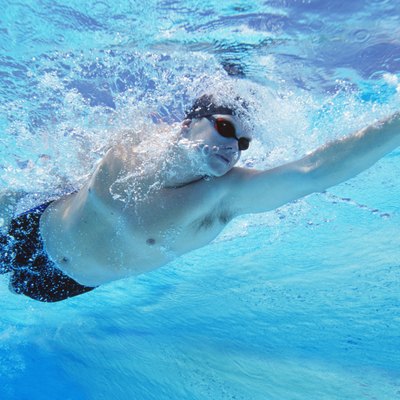 Underwater shot of professional male athlete swimming in pool