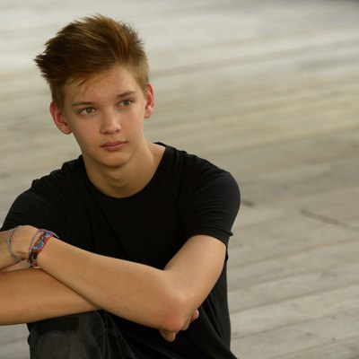 Teenager boy with hope outdoors