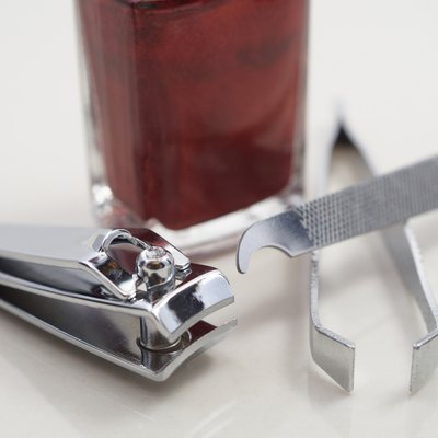 Nail clipper, file, nail polish and tweezer