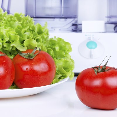 Tomatoes with green salad and kitchen processor