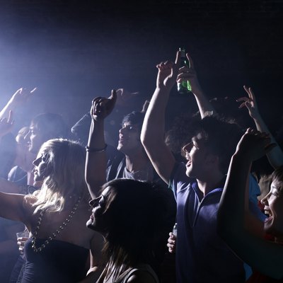 Group of friends celebrating at party in night club