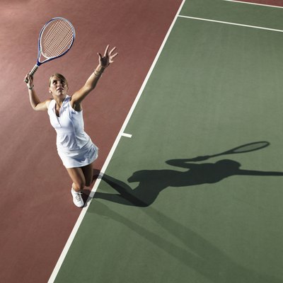 Young woman playing tennis, elevated view