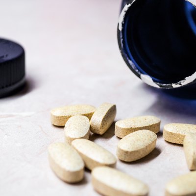 Vitamin and Mineral Pills/Tablets with Bottle Side View