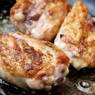 Chicken Thighs frying