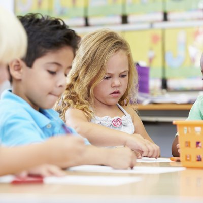 Group Of Elementary Age Children In Art Class