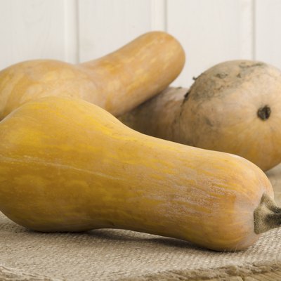 butternut pumpkins lying on a kitchen table