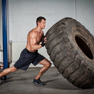 crossfit training - man flipping tire