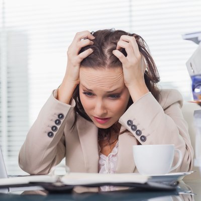 Nervous businesswoman pulling her hair out