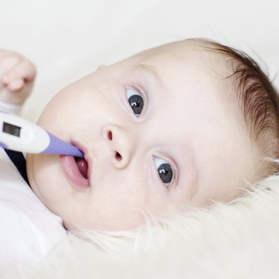 lovely baby take temperature with electronic thermometer
