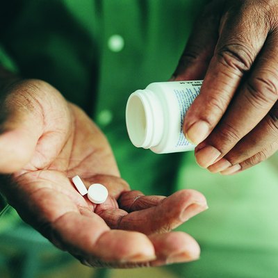 Close-up of Pills Being Held in Someone's Hands