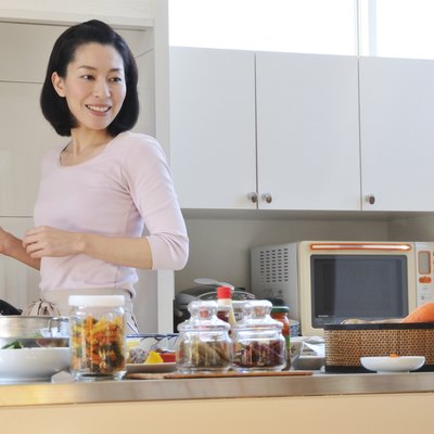 Mid Adult Woman with Apron Looking Back