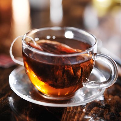 hot cup of tea steeping in glass