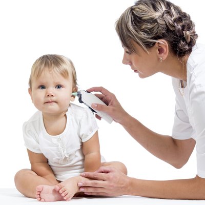 doctor measuring temperature cute baby girl