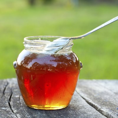 honey on wooden garden table