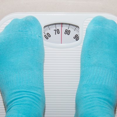 Closeup of a Asians weighed