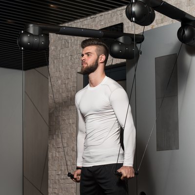 Healthy Young Man Doing Exercise For Shoulders