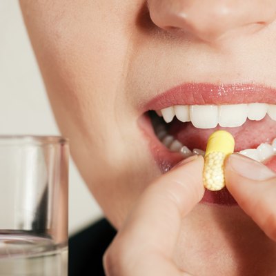 Woman taking a pill