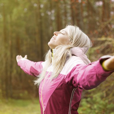 Woman breathes fresh air outdoors