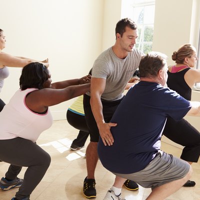 Fitness Instructor In Exercise Class For Overweight People