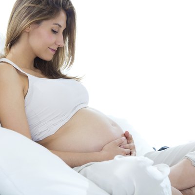 Pregnant woman relaxing at home.