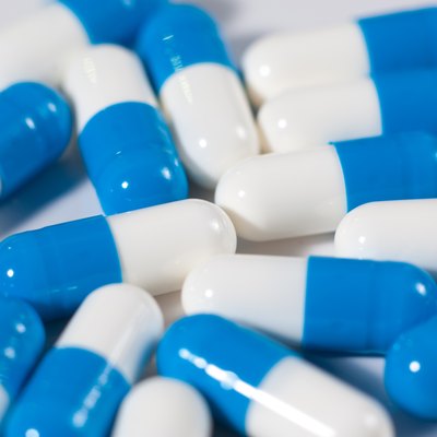Background of blue and white capsule pills