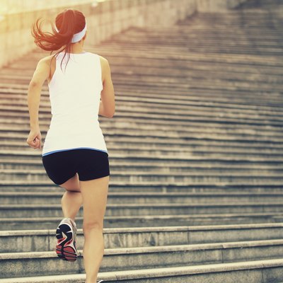 Runner athlete running on stairs.