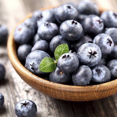 Blueberry in a wooden plate