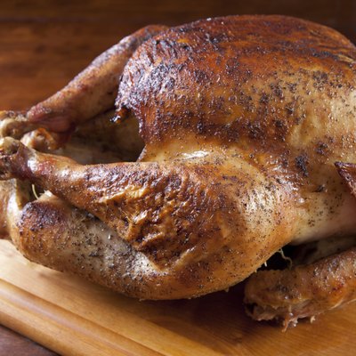 Roasted Turkey Resting on Wooden Board