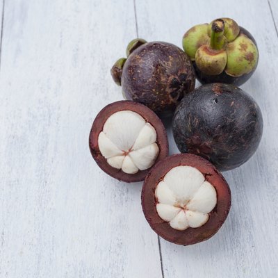 Mangosteen on wood background