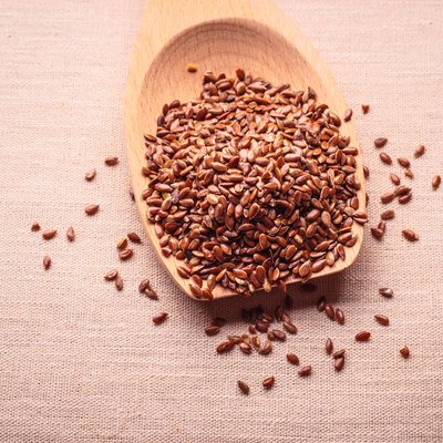 Flax seeds linseed on wooden spoon