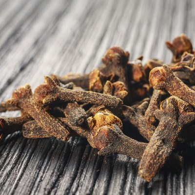 pile cloves on wood background