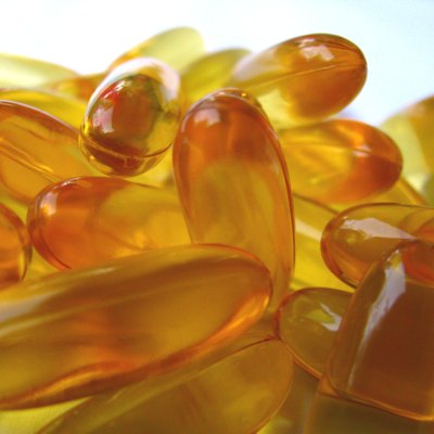 A close-up of fish oil tablets that contain omega-3 fatty acids