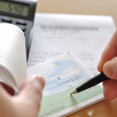 Business man writing check