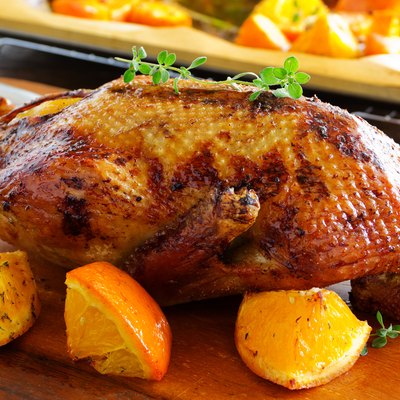 Roast duck with pumpkin and oranges.