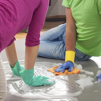 Couple cleaning floor