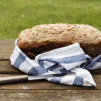 Wholemeal wheat spelt bread on wooden table