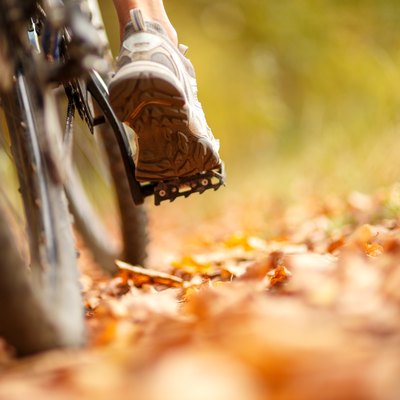 foot on pedal of bicycle