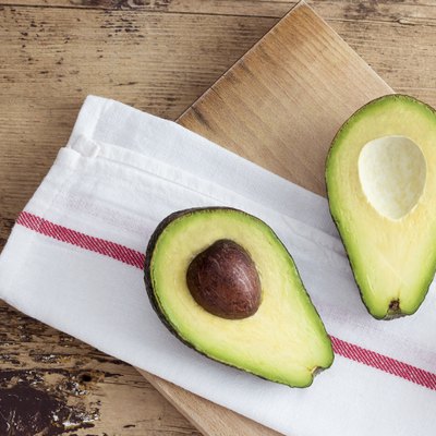Avocado on rustic wooden background