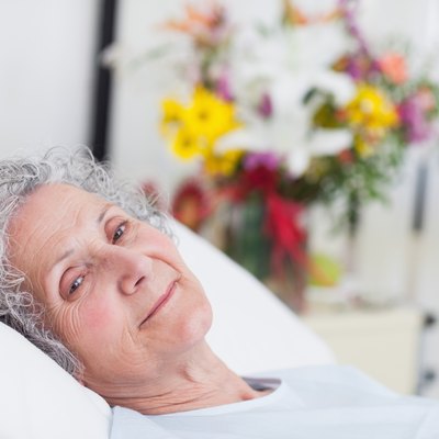 Peaceful senior woman lying in a hospital bed