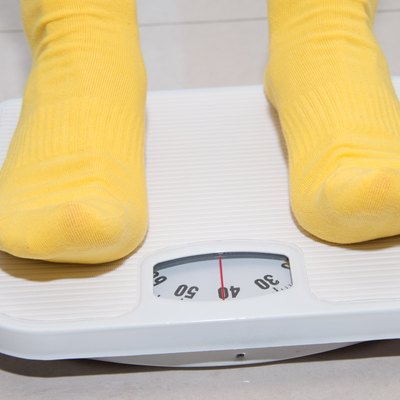 Closeup of a Asians weighed