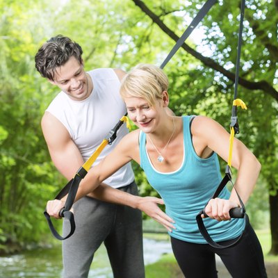 People doing suspension or sling trainer fitness