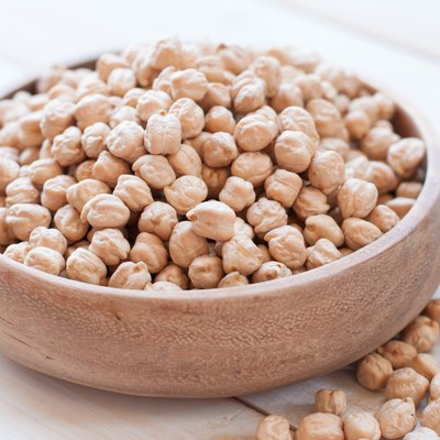 chick-pea on white wooden background