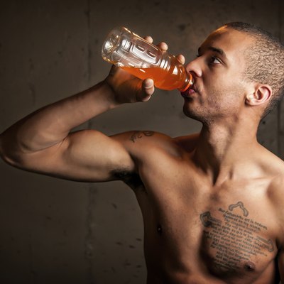 Black male drinking a sports drink